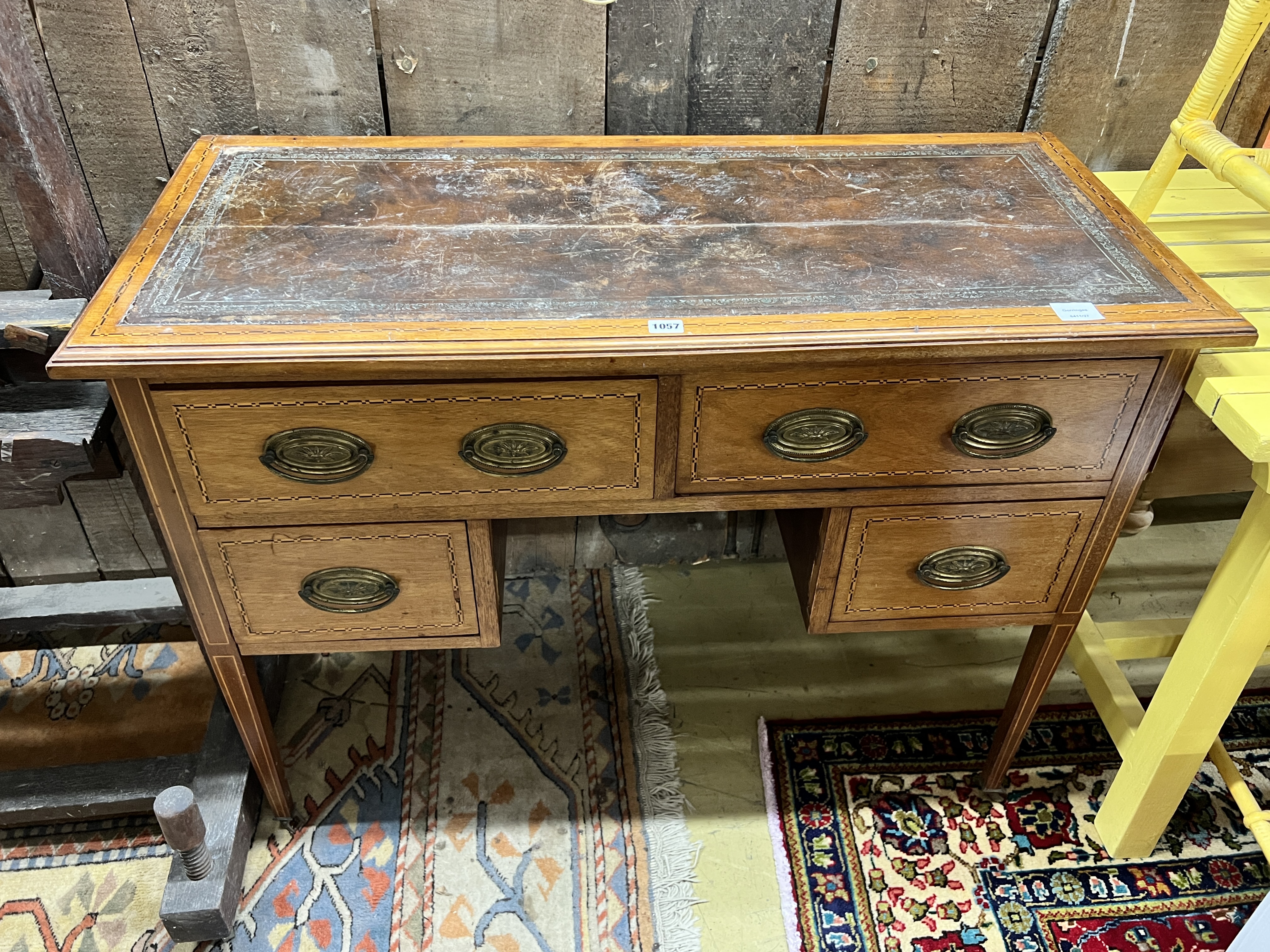 An Edwardian inlaid mahogany kneehole writing table, width 108cm, depth 47cm, height 79cm